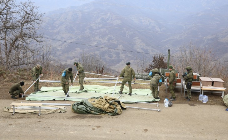 Russian peacekeepers dismantle tents that they set up in area of protests on Lachin-Khankandi road